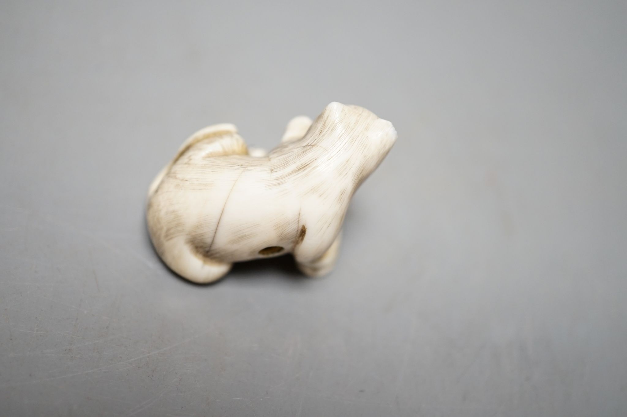 A 19th century ivory netsuke cat group and a Meij period ivory shibayama bezique marker, 9cm.